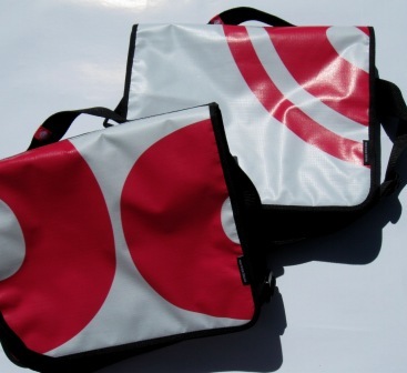 Recycled laptop bags made from Powershop's Baby Trump billboard campaign.